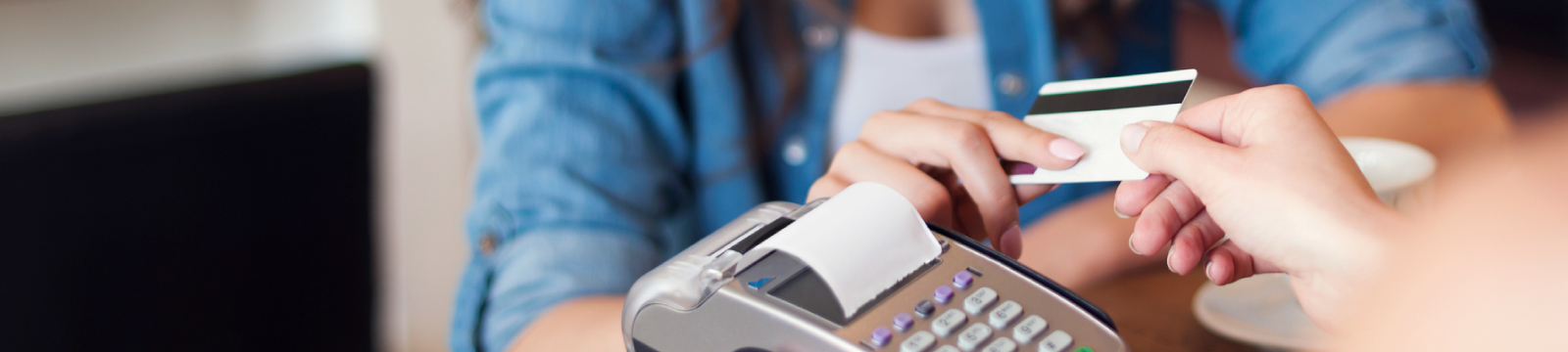 Woman using debit/credit card for payment